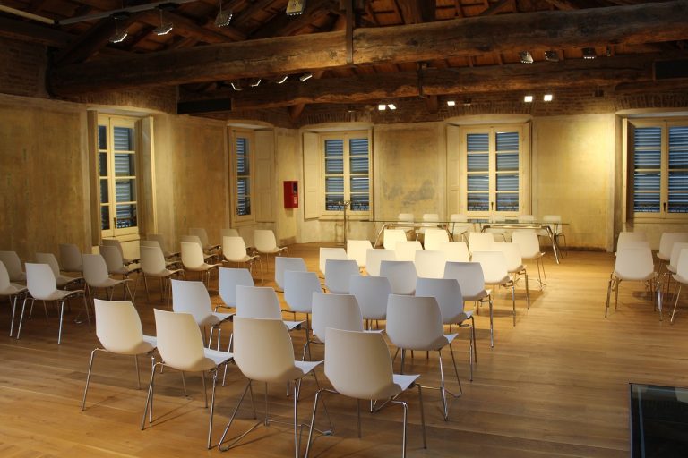 A meeting room with empty chairs